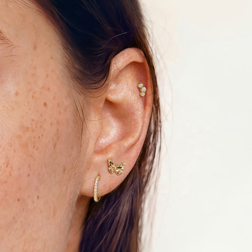 Três Diamond Flatback Stud in 14K yellow gold — supplier model photo 1; other earrings not included