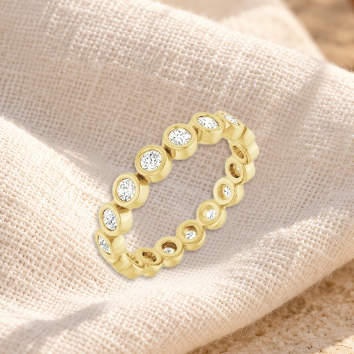 Círculo bezel diamond eternity band on cream linen