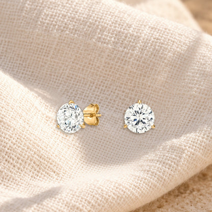 Essencial round diamond studs on cream linen