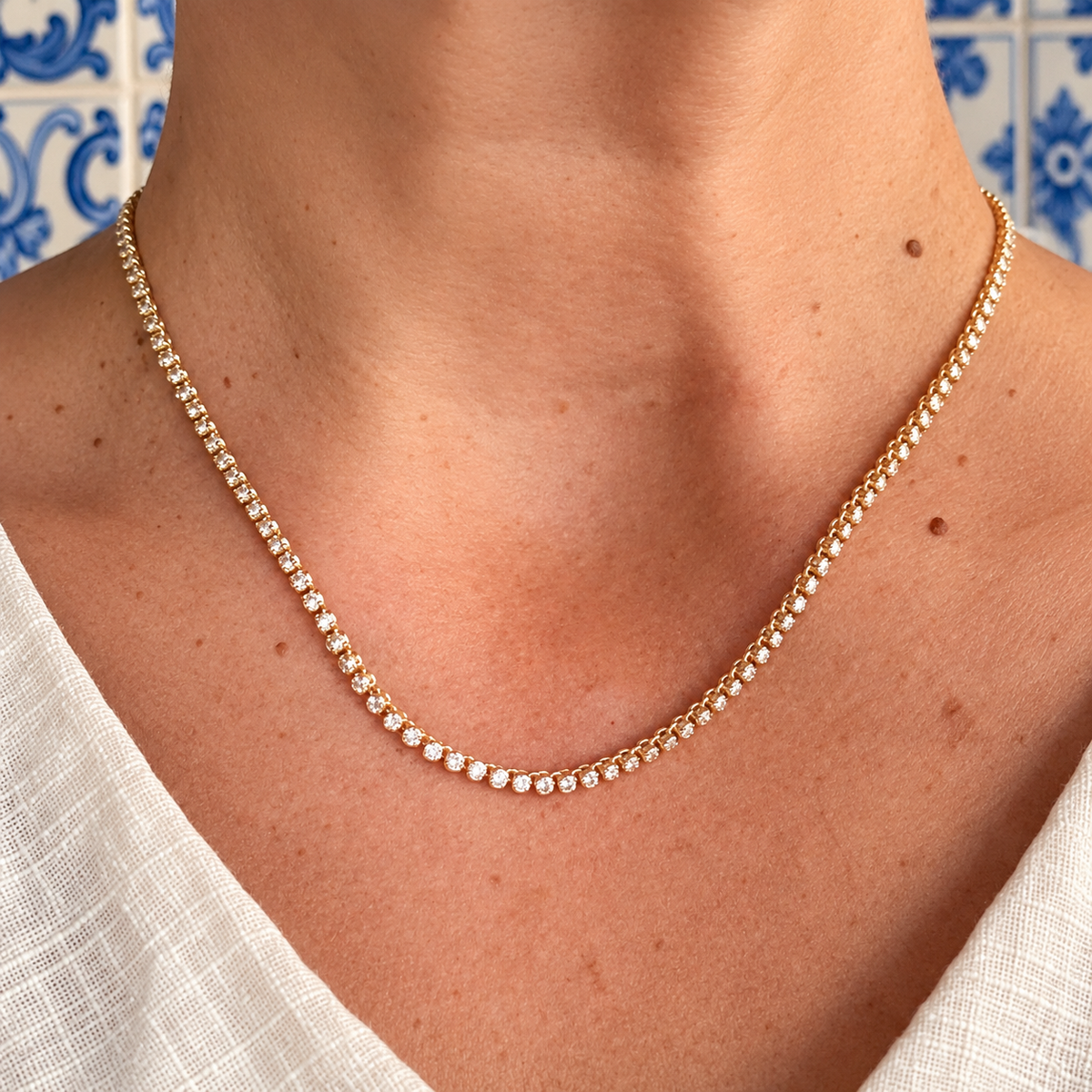 Linha mini tennis necklace on a model in L’OURO azulejo styling