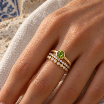 Círculo, Delicada and Verde rings stacked on a hand, styled image; sold separately